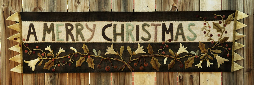 A Merry Christmas Wool Applique Table Runner pattern designed by Maggie Bonanomi - Kit and Handmade Options Available, using Blackberry Primitives Hand-dyed Fabrics